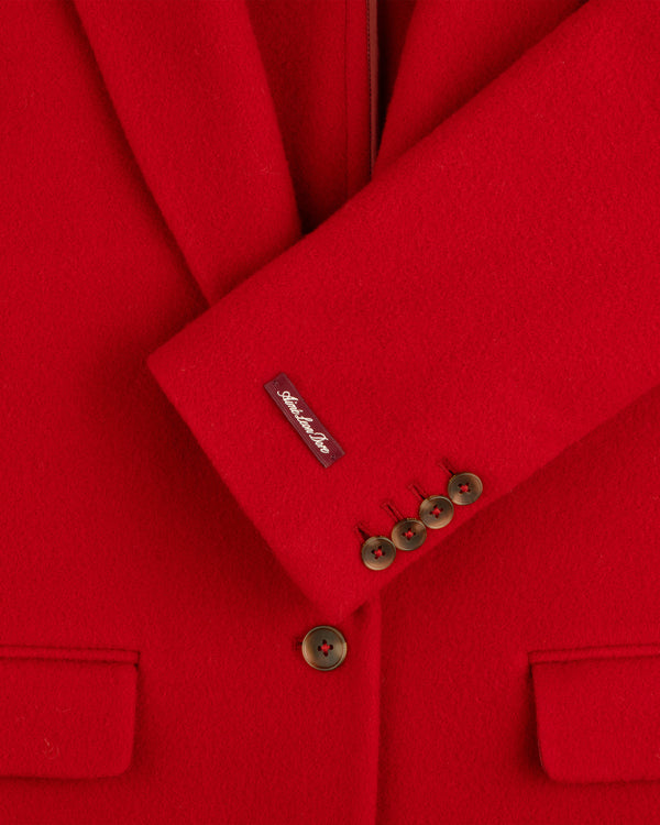 Bright red Wool Sportcoat with four buttons on the cuff and a label on the sleeve.