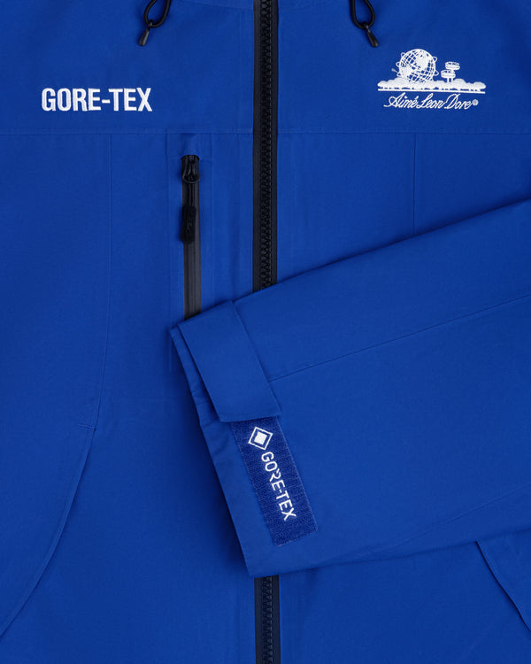Blue Cropped GORE-TEX Shell Jacket with a GORE-TEX logo on the chest and a matching tab on the sleeve cuff.