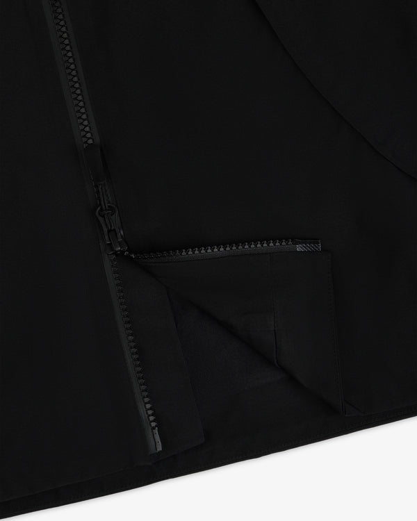 Close-up of a black Cropped GORE-TEX Shell Jacket with a front zipper closure.