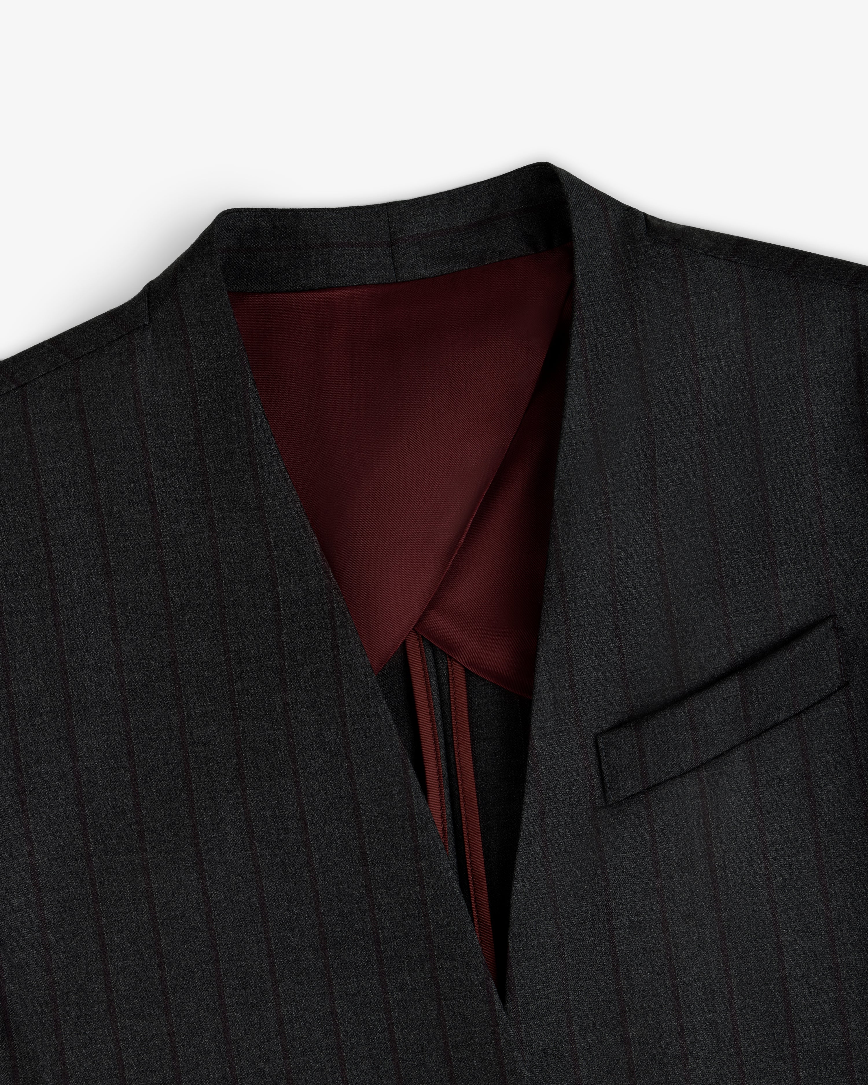 Collarless Striped Blazer in dark gray pinstripe with a deep V-neck and a maroon inner lining.