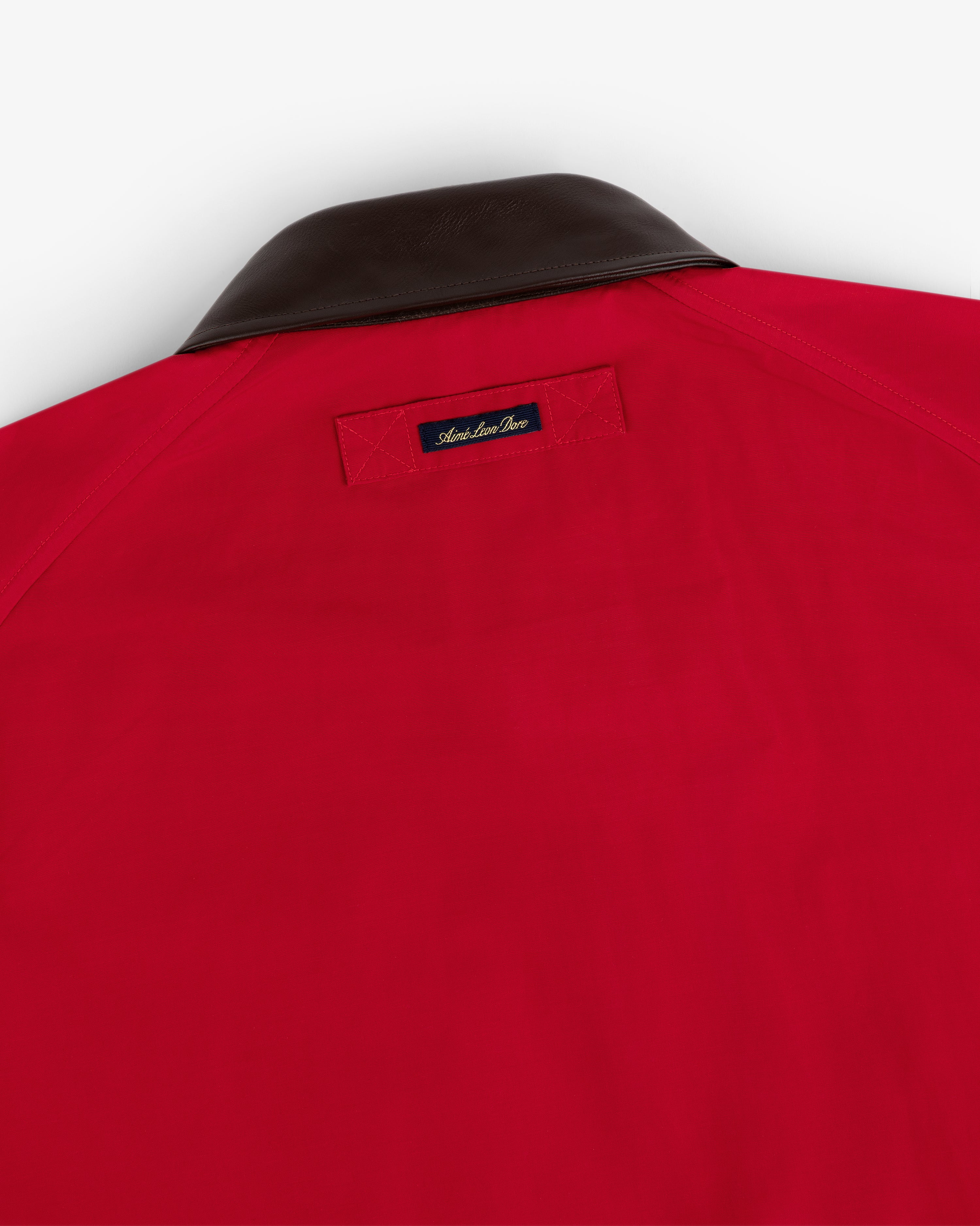 Lightweight Barn Jacket in red with a dark brown collar and a small black label on the upper back.