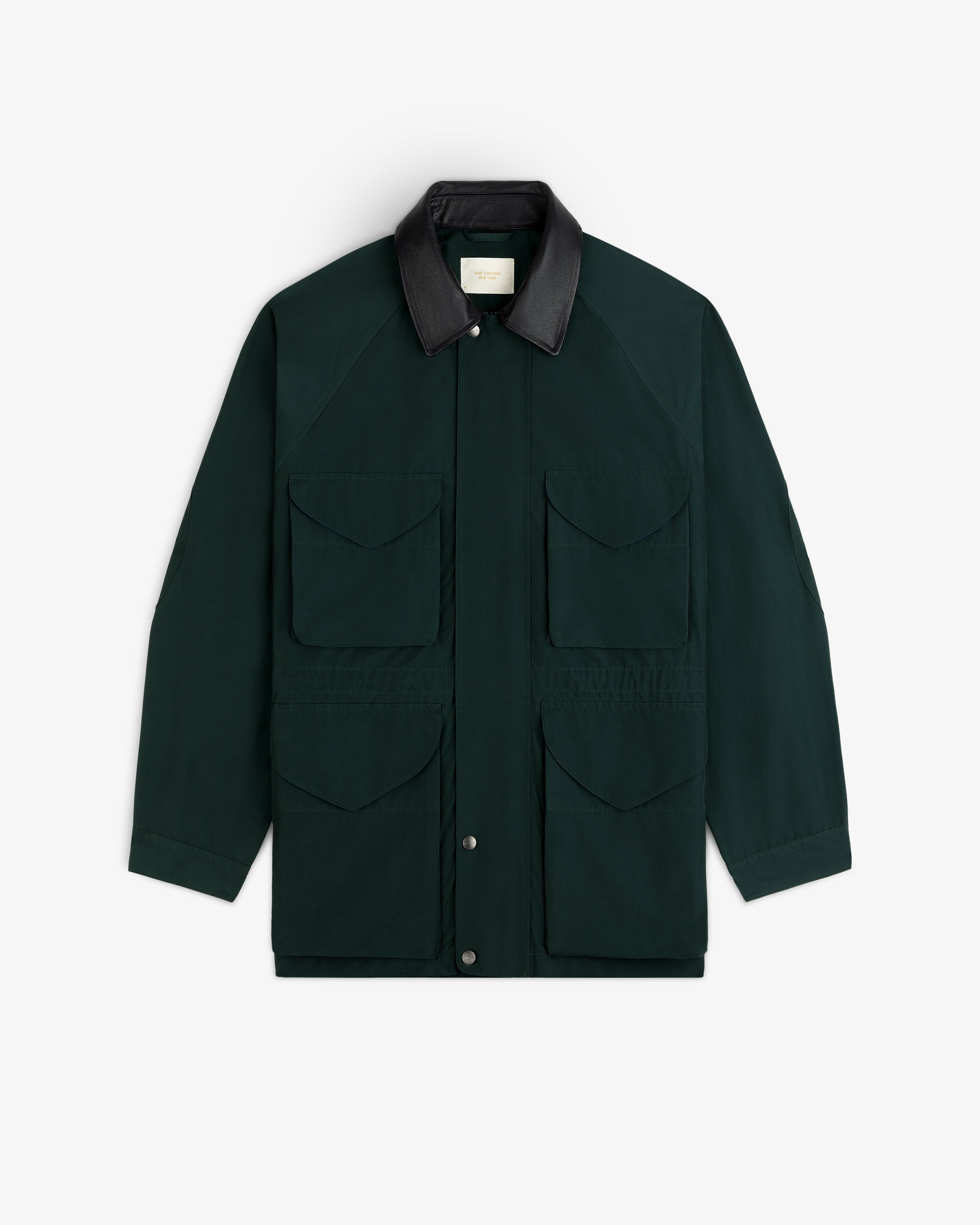 Lightweight Barn Jacket in dark green with four front pockets, black collar, shown on a white background.
