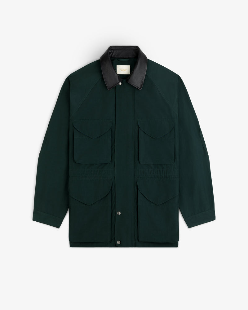 Lightweight Barn Jacket in dark green with four front pockets, black collar, shown on a white background.