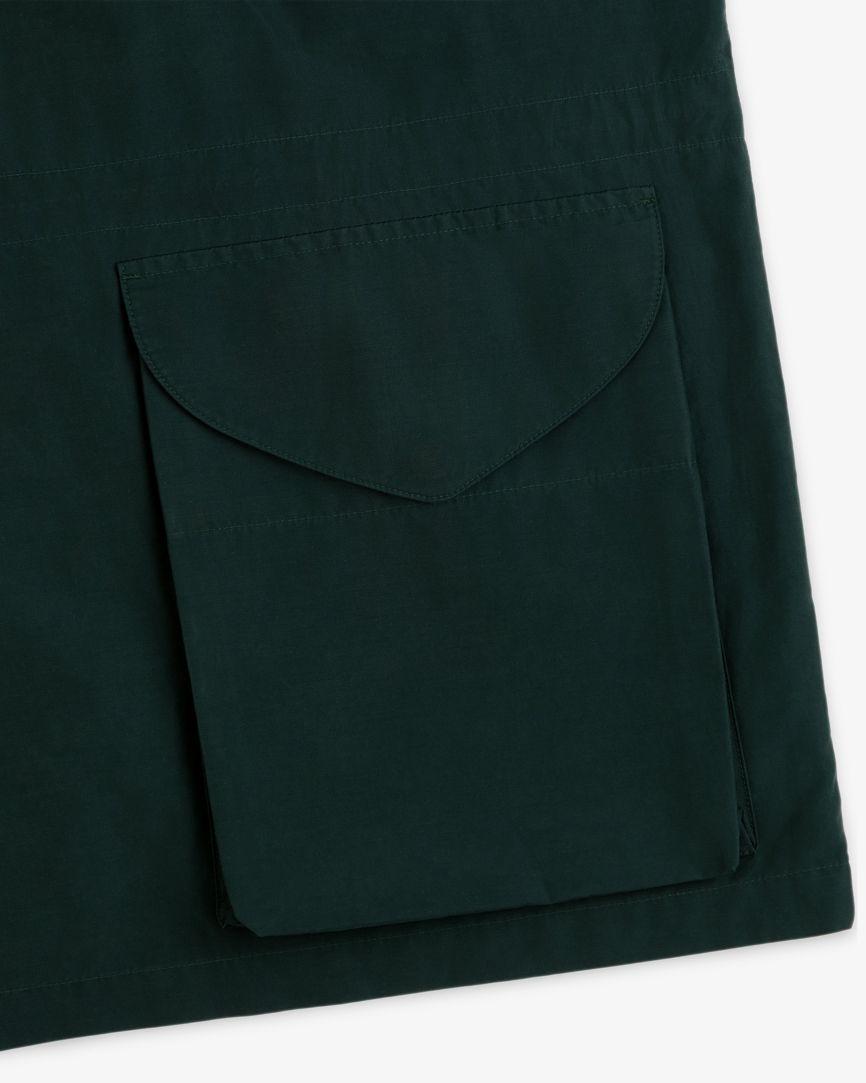 Lightweight Barn Jacket in dark green with a large square flap pocket stitched on the front.