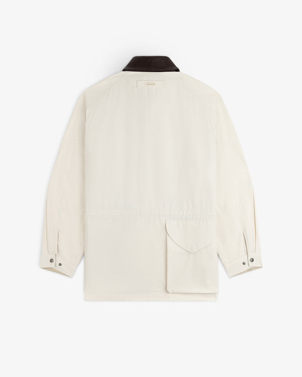 Lightweight Barn Jacket—white with black collar, button cuffs, and large back pocket, shown on white background.