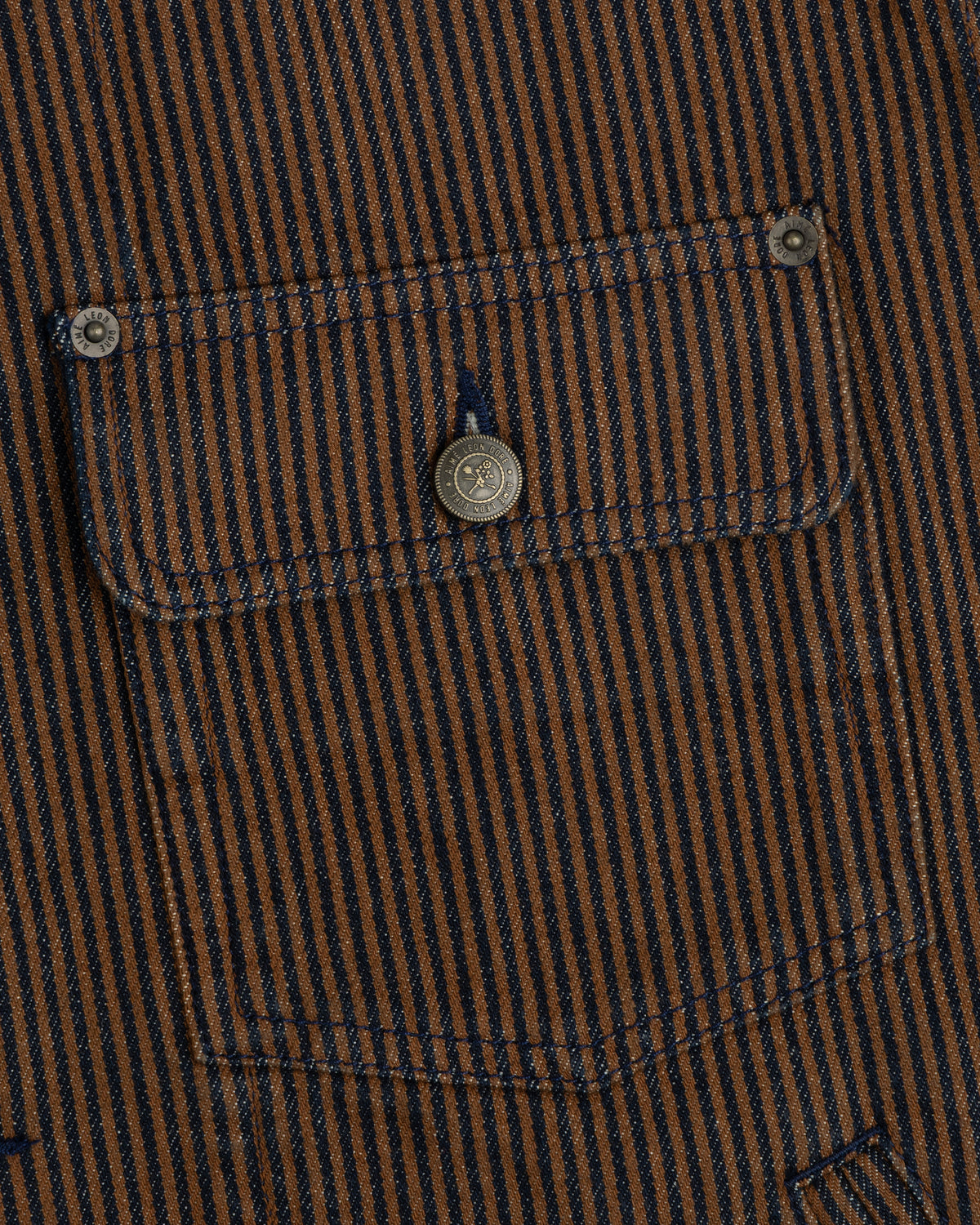 Hickory Stripe Denim Trucker Jacket: brown/navy vertical stripes, buttoned pocket, two metal fasteners.