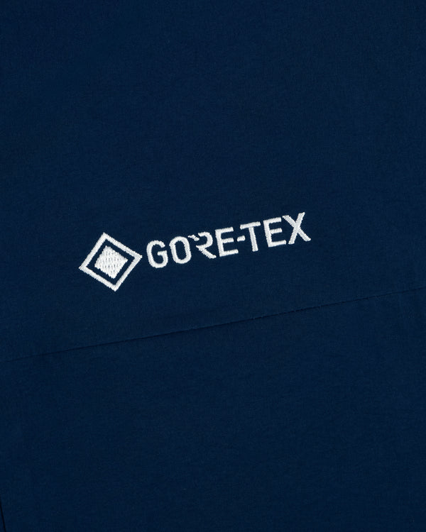 Navy blue Yankees GORE-TEX Rain Delay Jacket with white embroidered logo and diamond icon.