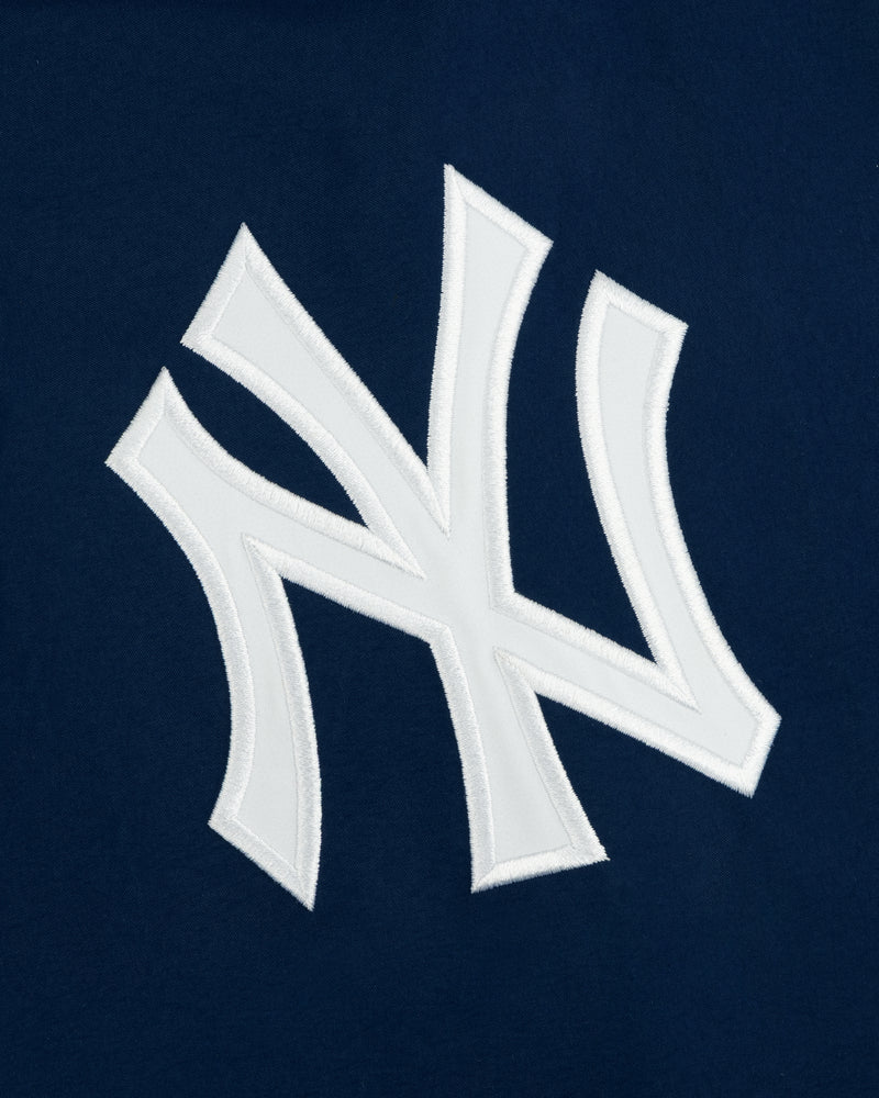Yankees GORE-TEX Rain Delay Jacket with a white NY logo on dark blue, featuring the iconic team emblem.