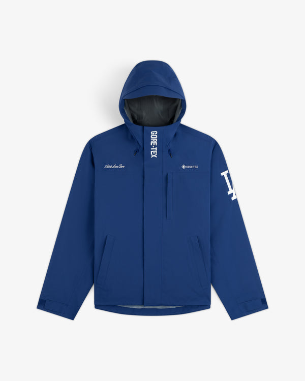 Dodgers GORE-TEX Rain Delay Jacket: Blue, hooded, LA sleeve logo, front zip, and two zippered pockets.