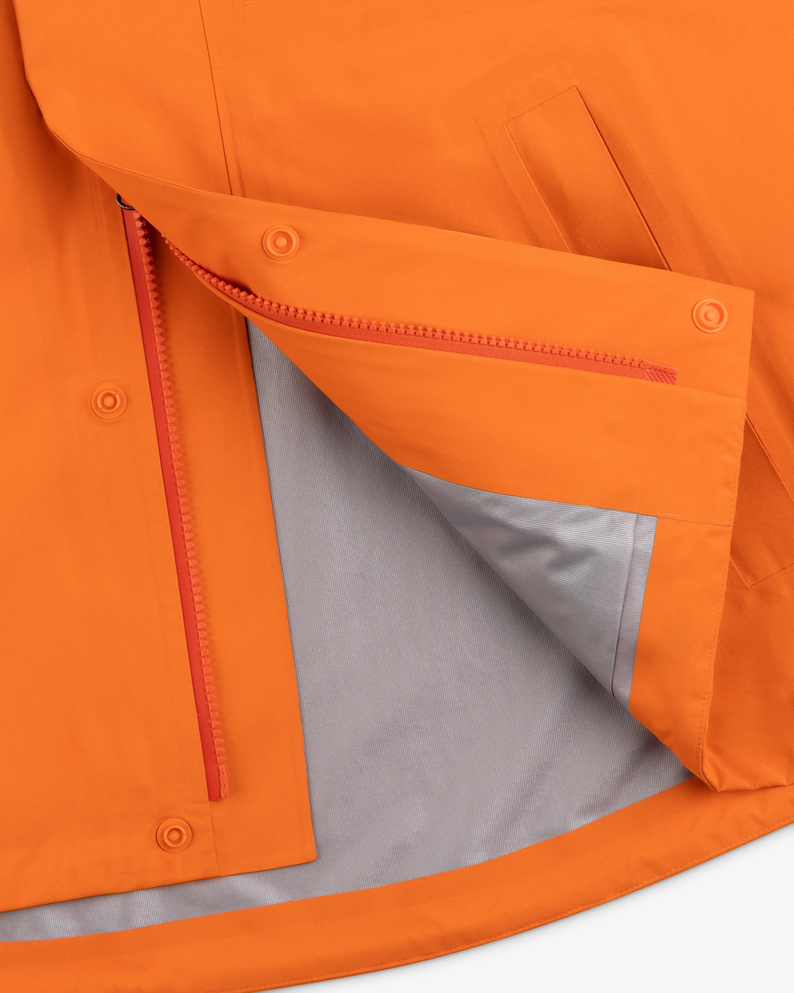 Mets GORE-TEX Rain Delay Jacket in orange with red zipper, snap buttons, and gray lining, partially unzipped to show inside.
