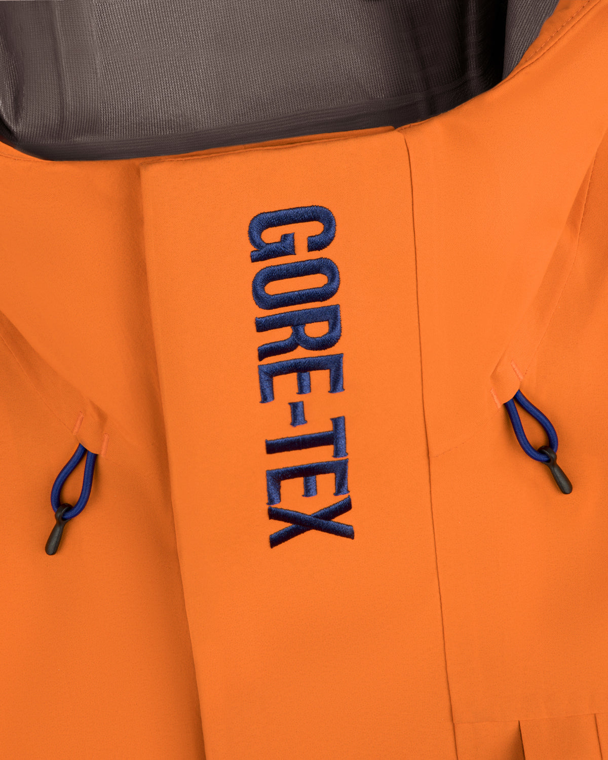 Close-up of the Mets GORE-TEX Rain Delay Jacket with blue text and blue drawstrings on each side.