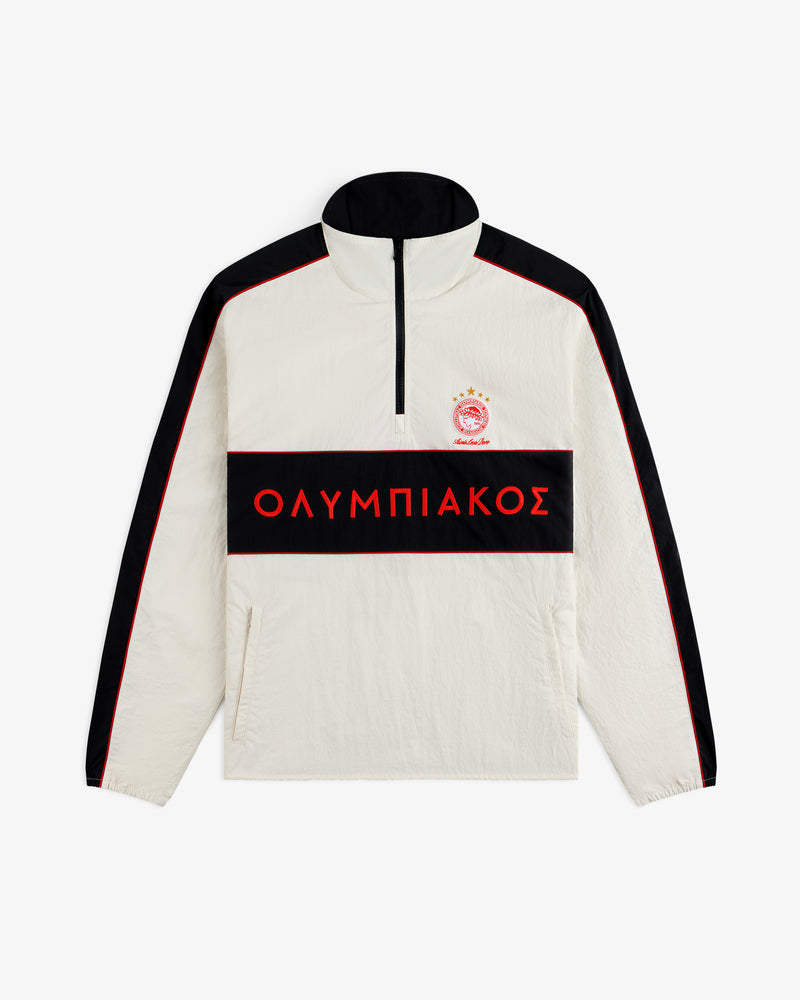 ALD / Olympiacos F.C. Nylon Quarter Zip Pullover in off-white with black sleeves, a chest stripe, and red Greek lettering.