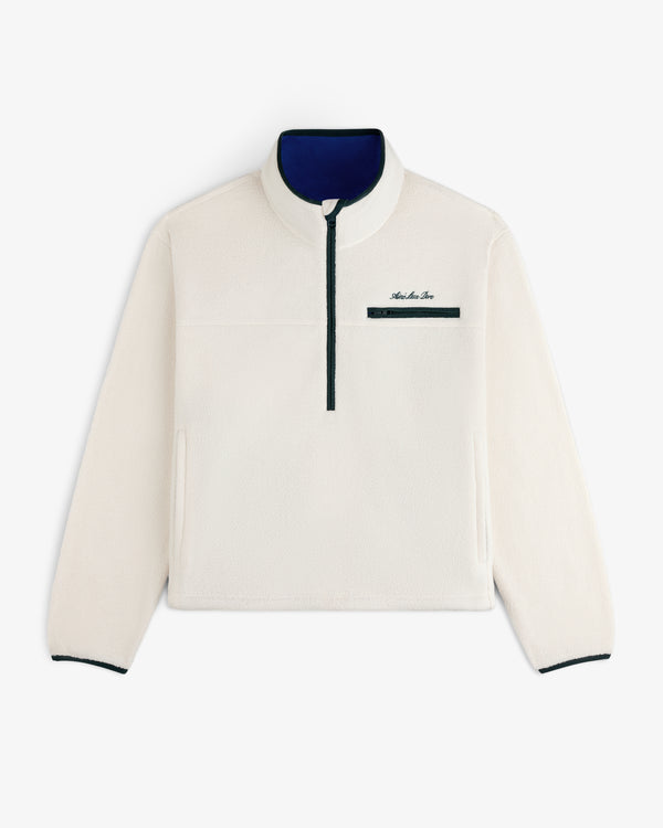 Script Fleece Half Zip Pullover in off-white fleece with a navy blue zippered chest pocket and blue inner collar.