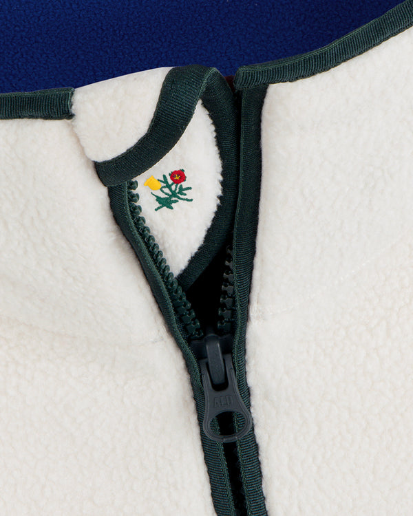 Off-white Script Fleece Half Zip Pullover with a dark green half-zip closure featuring a small embroidered flower icon.
