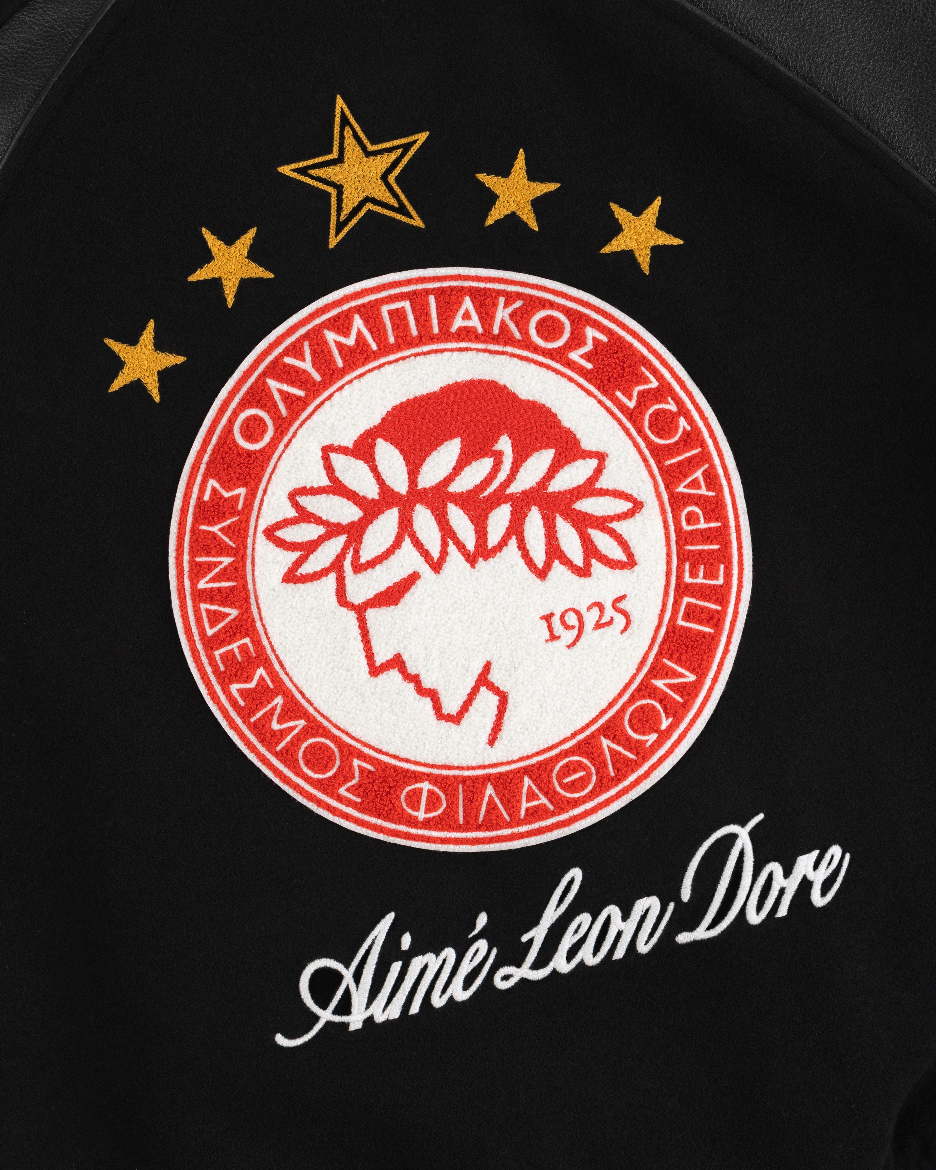 ALD / Olympiacos F.C. Team Leather Jacket with an embroidered team crest and script logo on black fabric.