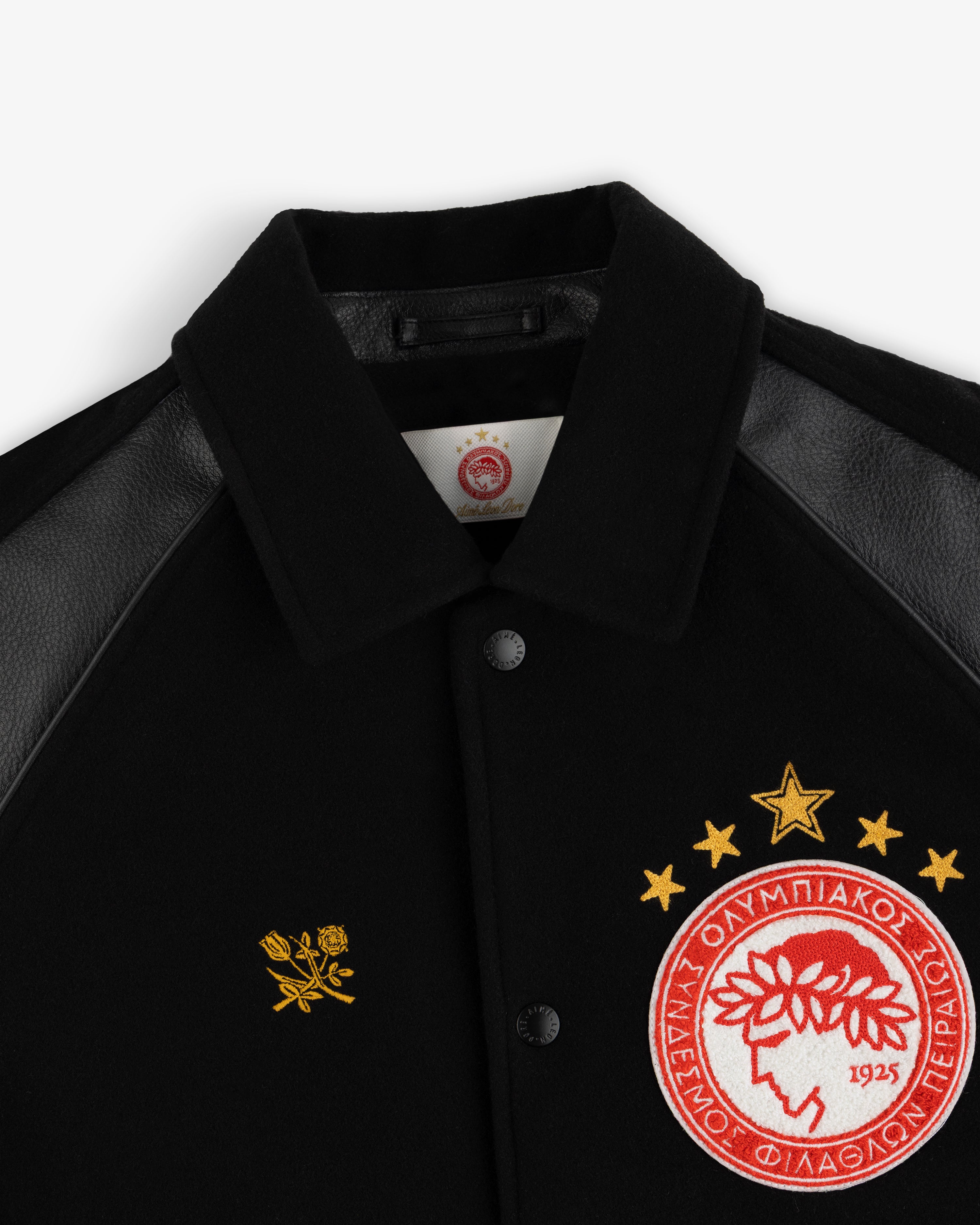 ALD / Olympiacos F.C. Team Leather Jacket: black with leather sleeves, chest rose embroidery, and a five-star team crest.