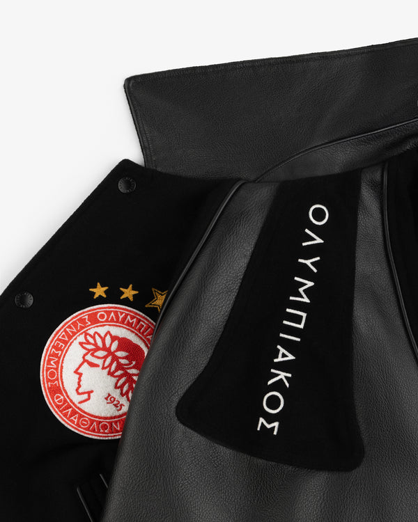 ALD / Olympiacos F.C. Team Leather Jacket featuring a red circular patch with three gold stars and Greek text on the chest.