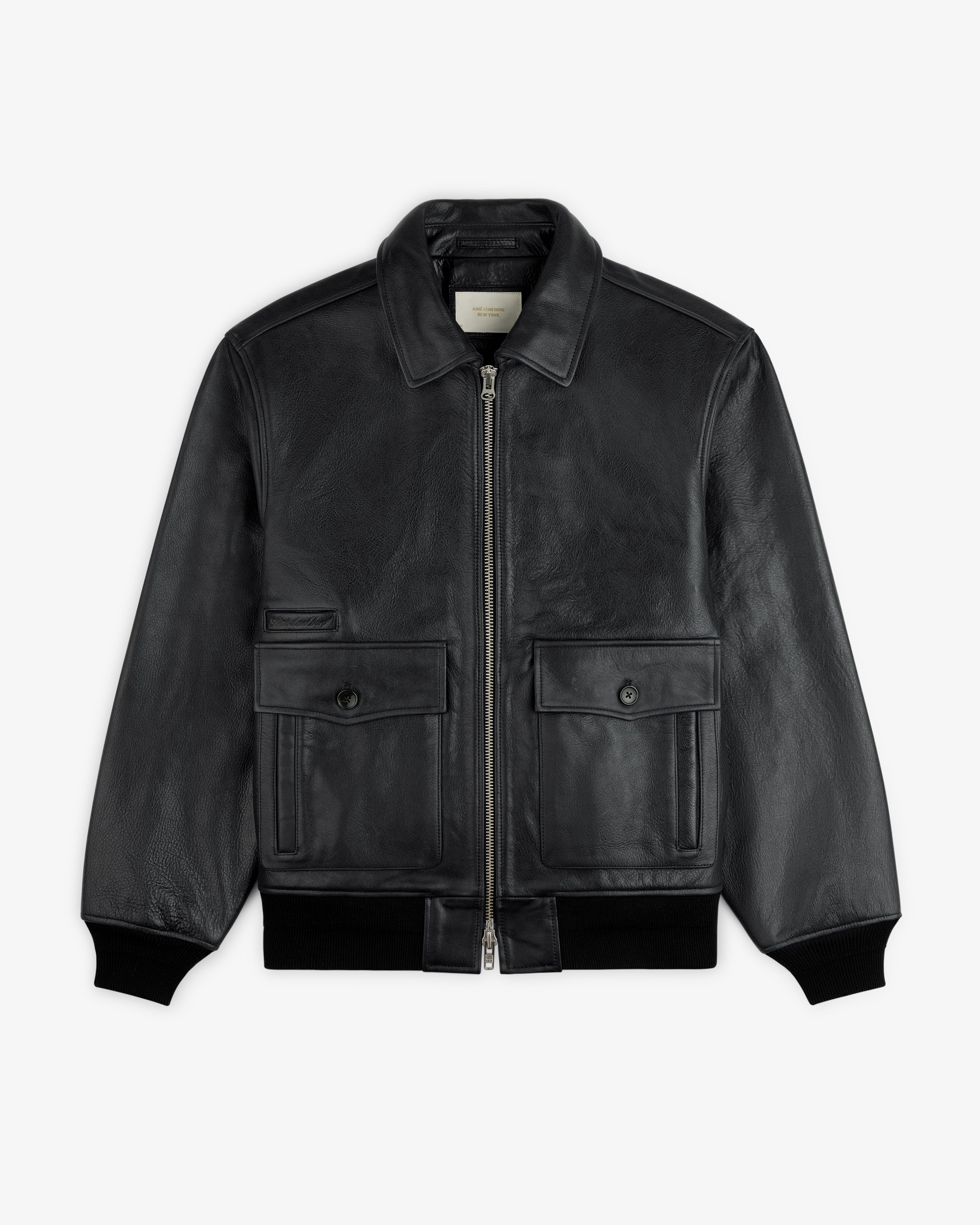 Napa Leather Bomber Jacket in black featuring a front zipper, two buttoned chest pockets, and ribbed cuffs.