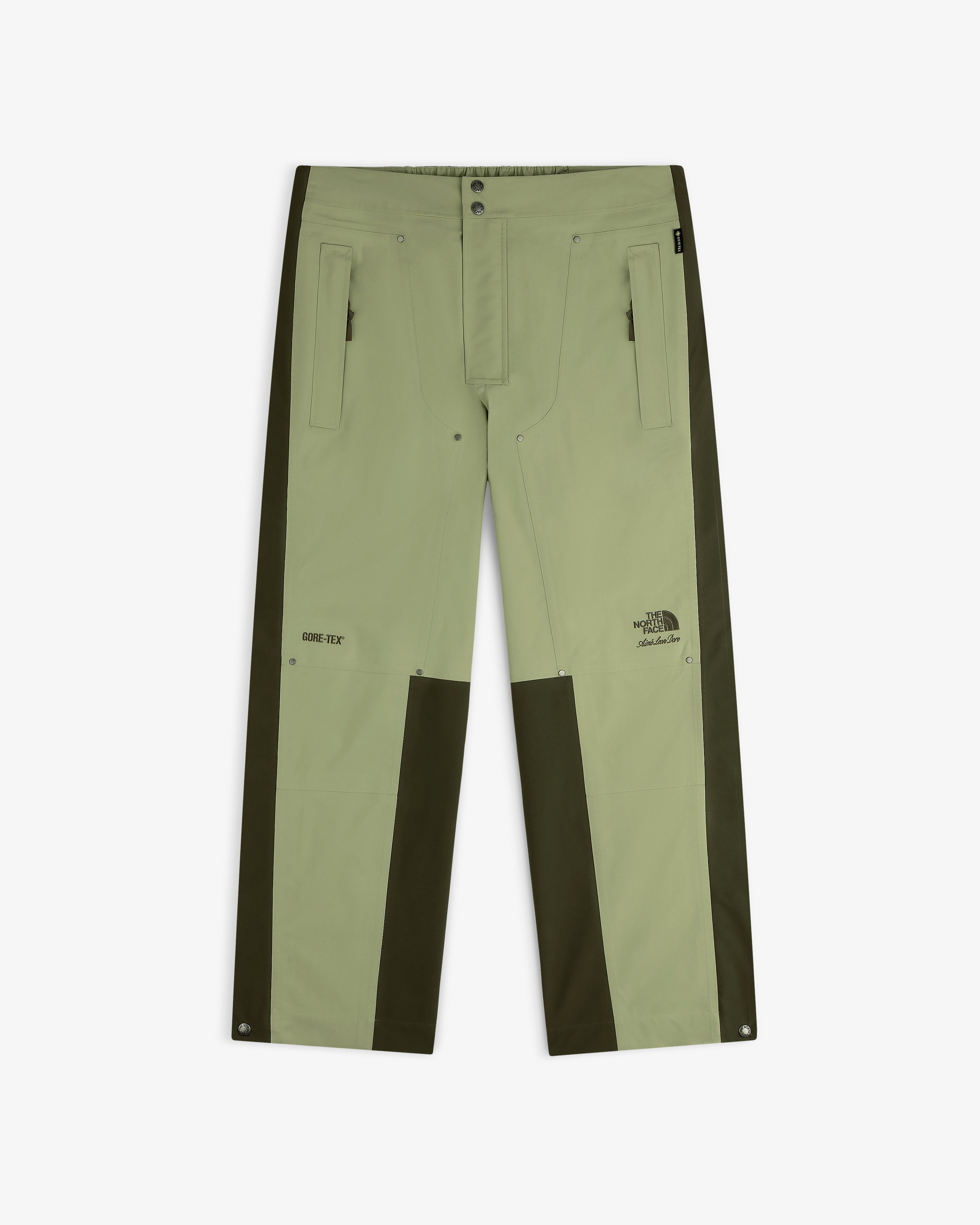 Light green ALD/The North Face GORE-TEX Pant with dark green panels, zip pockets, logos; laid flat on white.