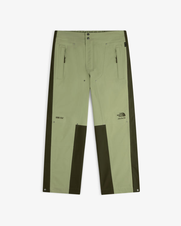 Light green ALD/The North Face GORE-TEX Pant with dark green panels, zip pockets, logos; laid flat on white.