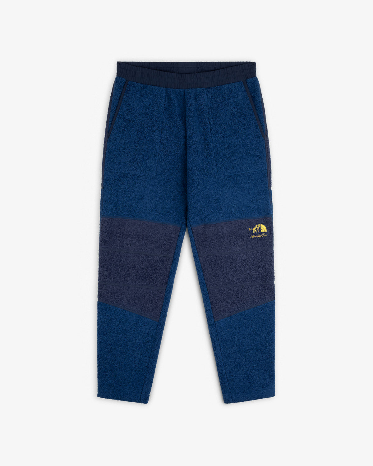 ALD / The North Face Denali Fleece Pant: Blue fleece, navy panels, elastic waist, pockets, yellow logo on left thigh.