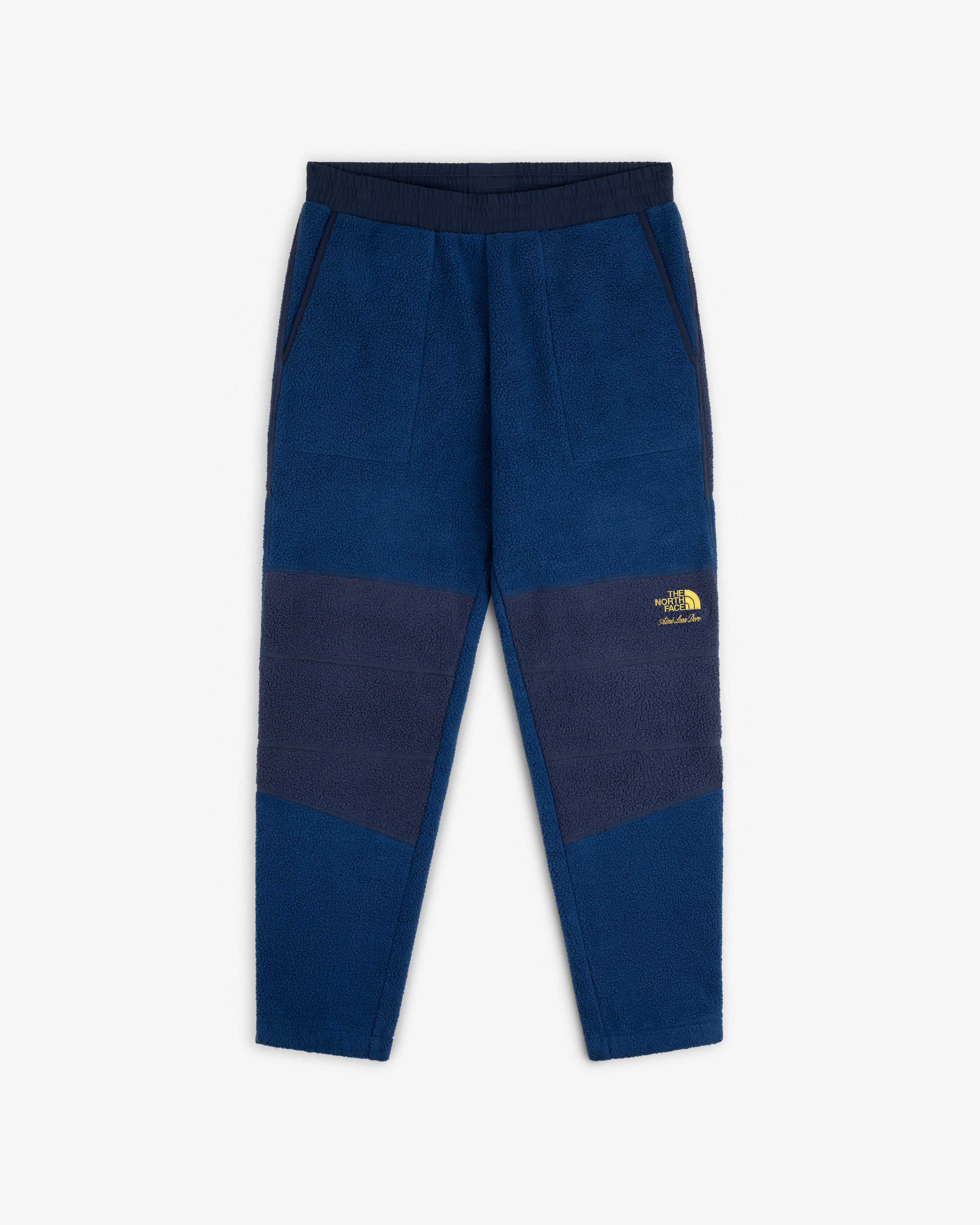ALD / The North Face Denali Fleece Pant: Blue fleece, navy panels, elastic waist, pockets, yellow logo on left thigh.