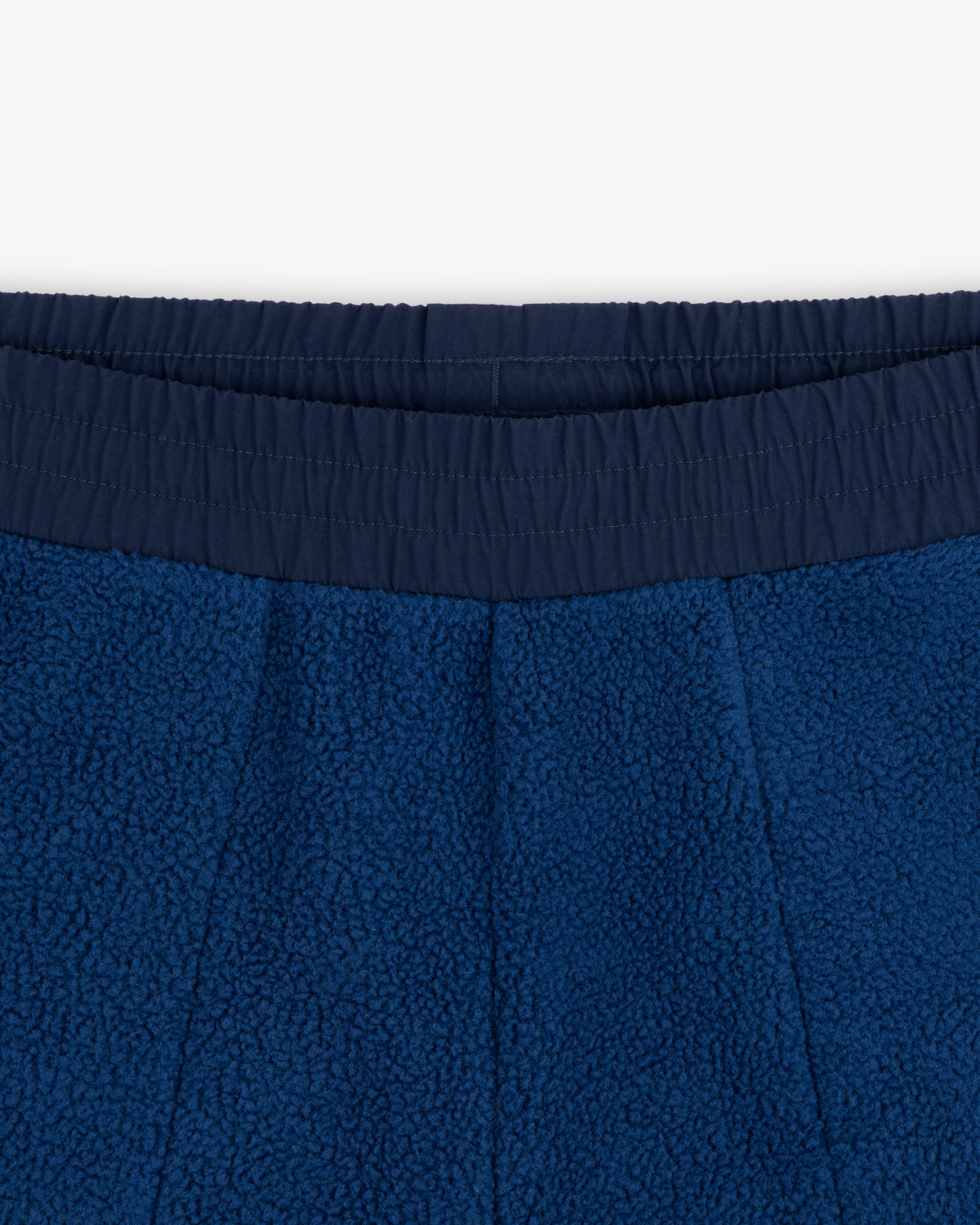 Close-up of ALD / The North Face Denali Fleece Pant’s blue fleece waistband with elastic, texture, and stitching detail.