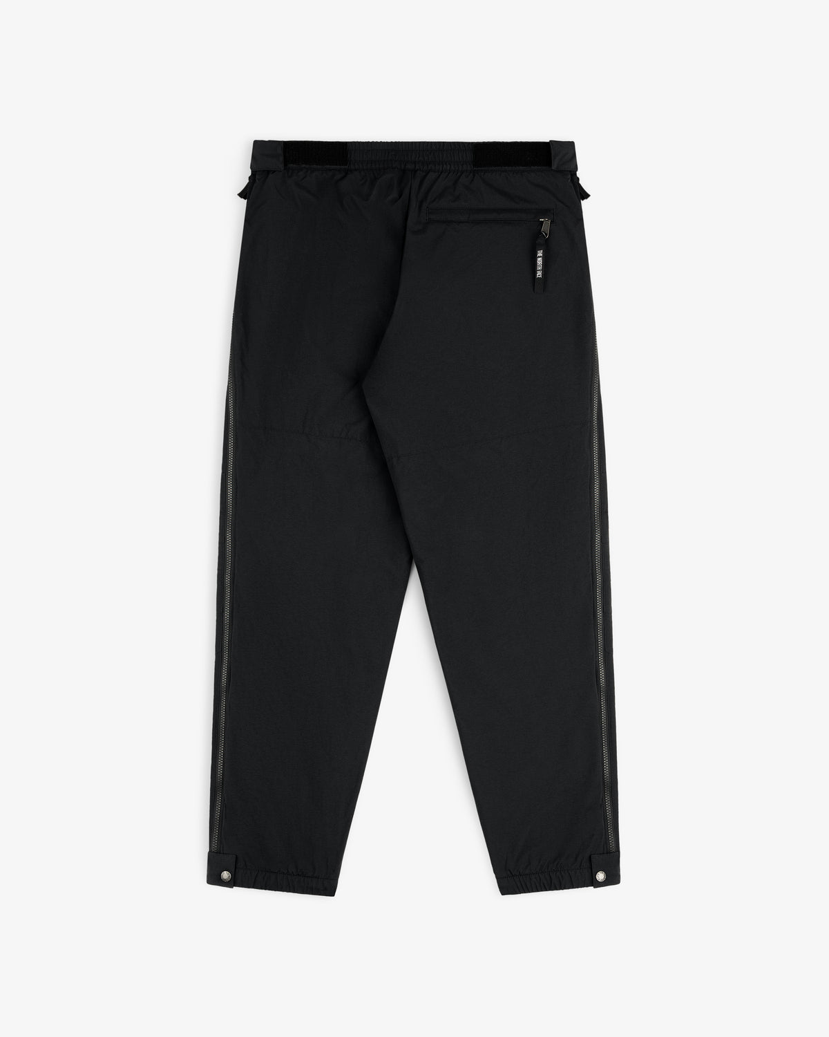ALD / The North Face Nylon Denali Pant in black features elastic waist, zip back pocket, and snap ankle closures.