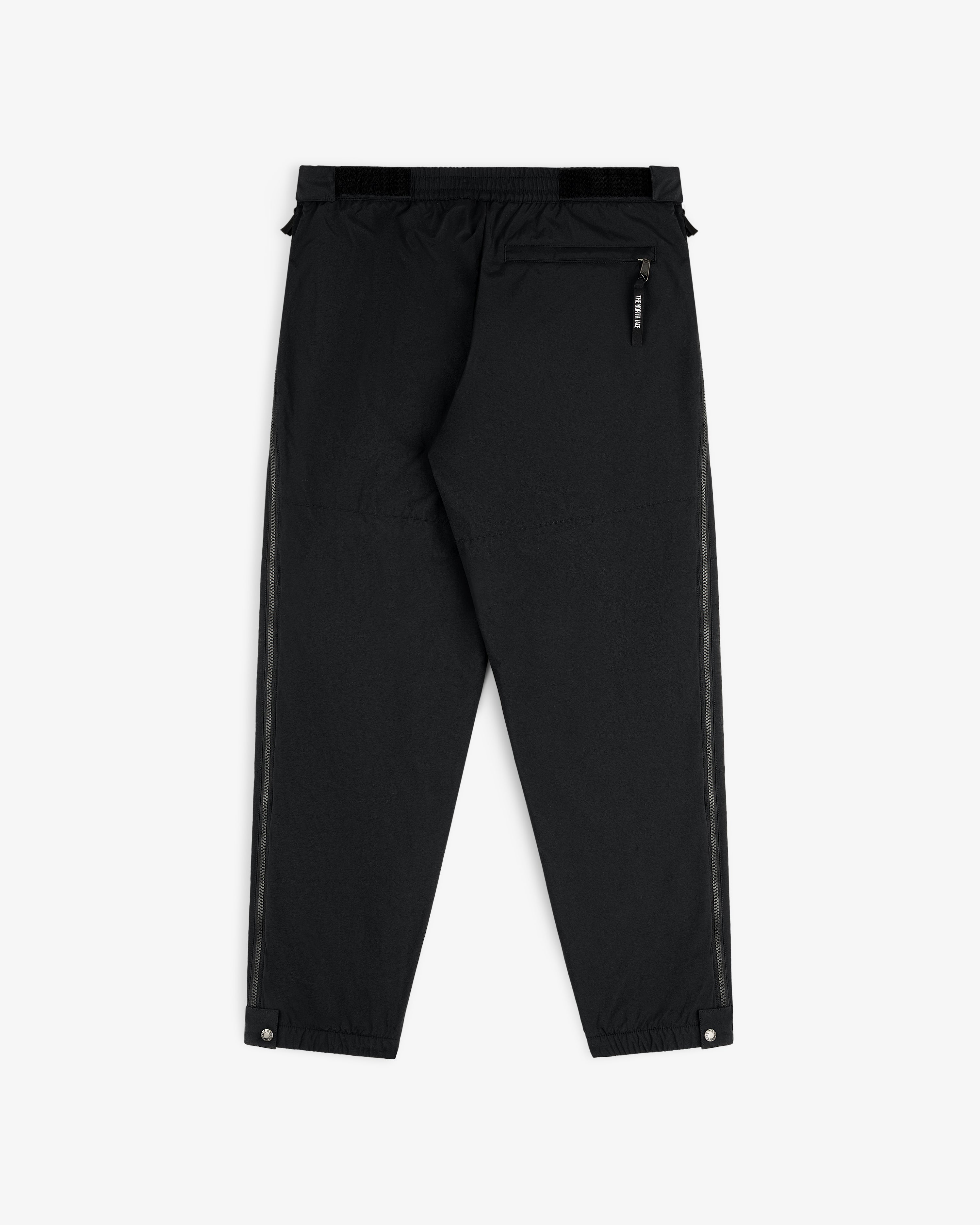 ALD / The North Face Nylon Denali Pant in black features elastic waist, zip back pocket, and snap ankle closures.