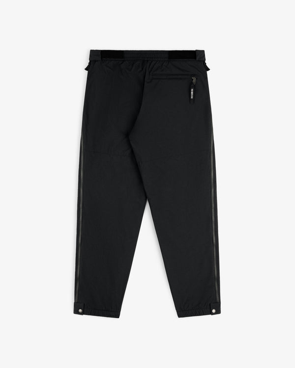 ALD / The North Face Nylon Denali Pant in black features elastic waist, zip back pocket, and snap ankle closures.