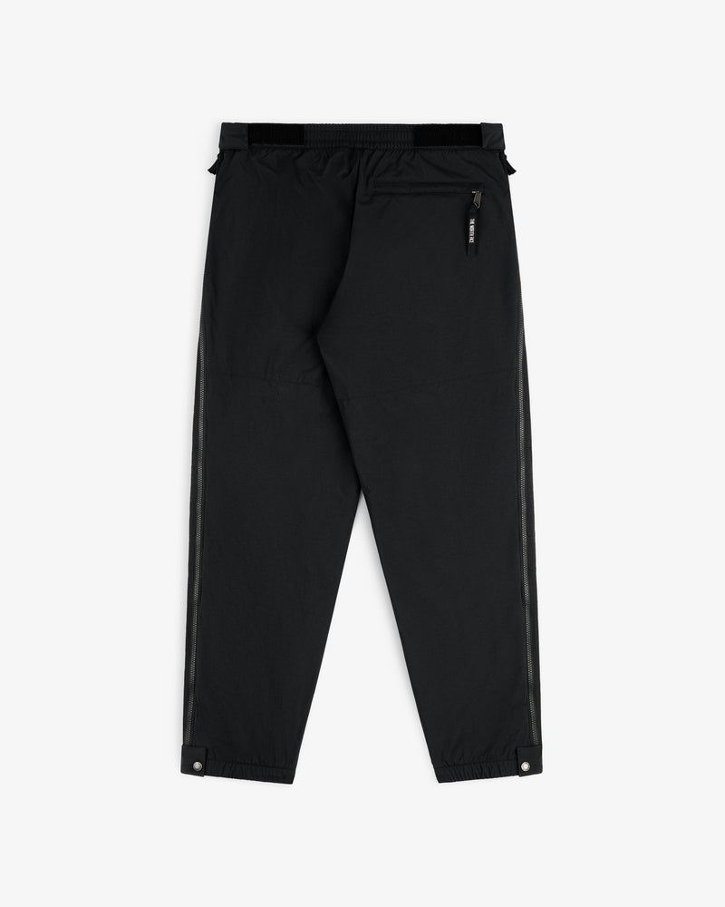 ALD / The North Face Nylon Denali Pant in black features elastic waist, zip back pocket, and snap ankle closures.