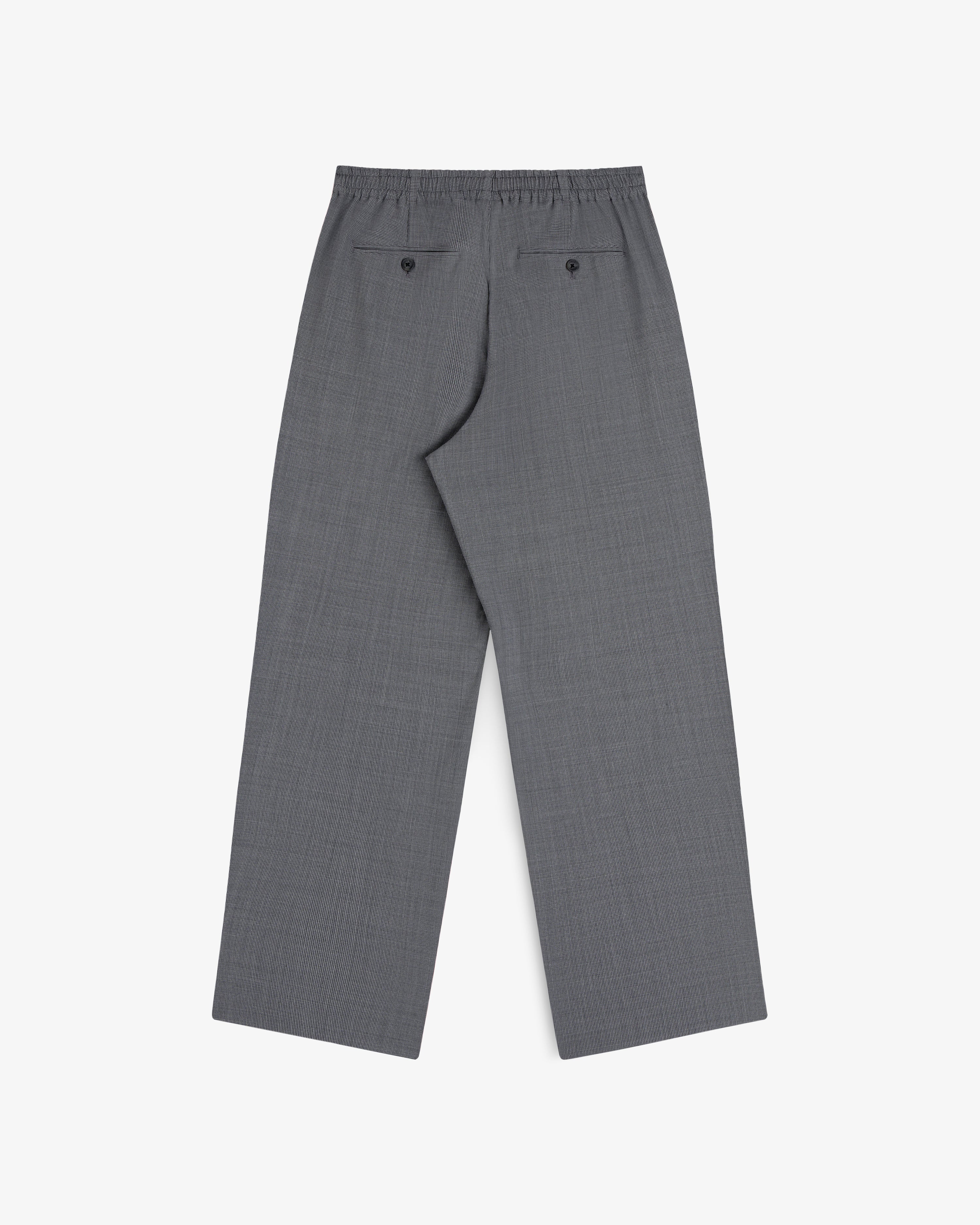 Houndstooth trouser with elastic waist, loose fit, 2 back pockets, laid flat on white background.