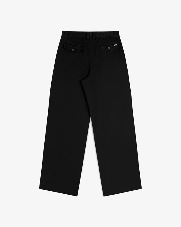 Double Pleated Officer Pant in black, wide-leg with belt loops and buttoned back pockets, shown from the rear.