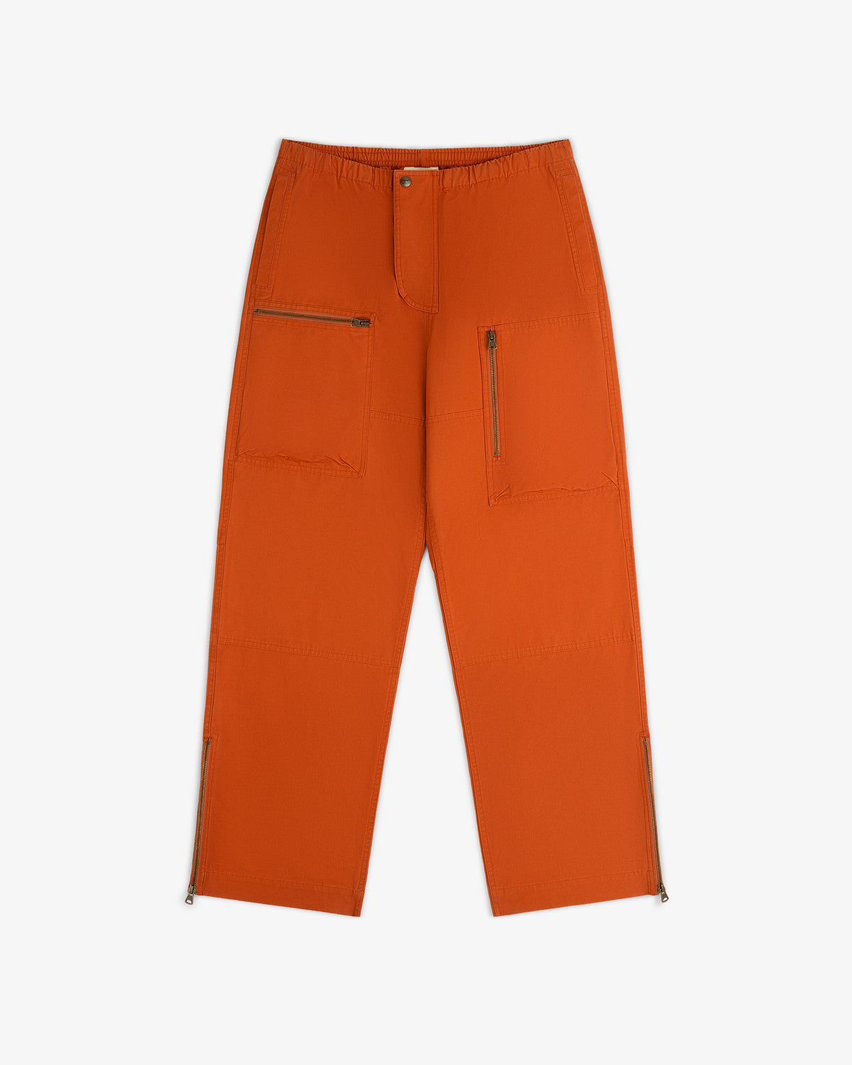 Garment Washed Aviator Pants in burnt orange with zippered cargo pockets and leg openings.