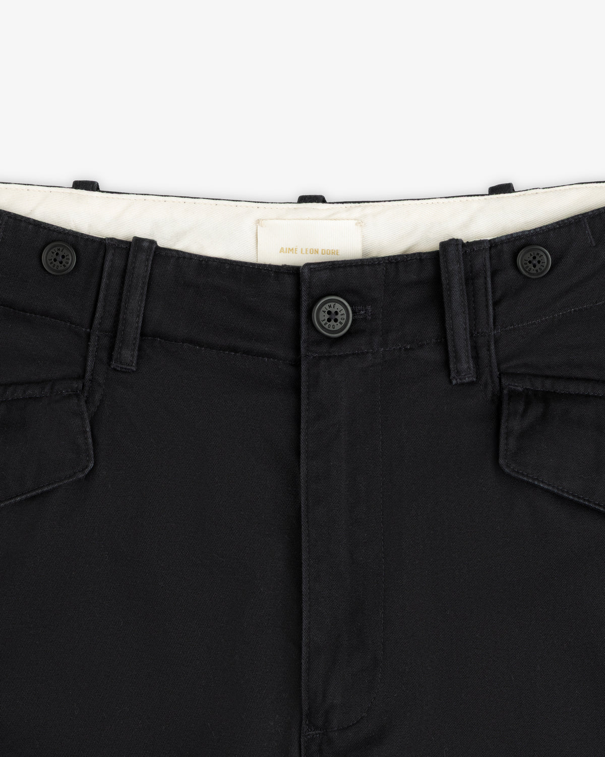 Close-up of the waistband, front buttons, and belt loops on the Fatigue Pant with visible stitching.