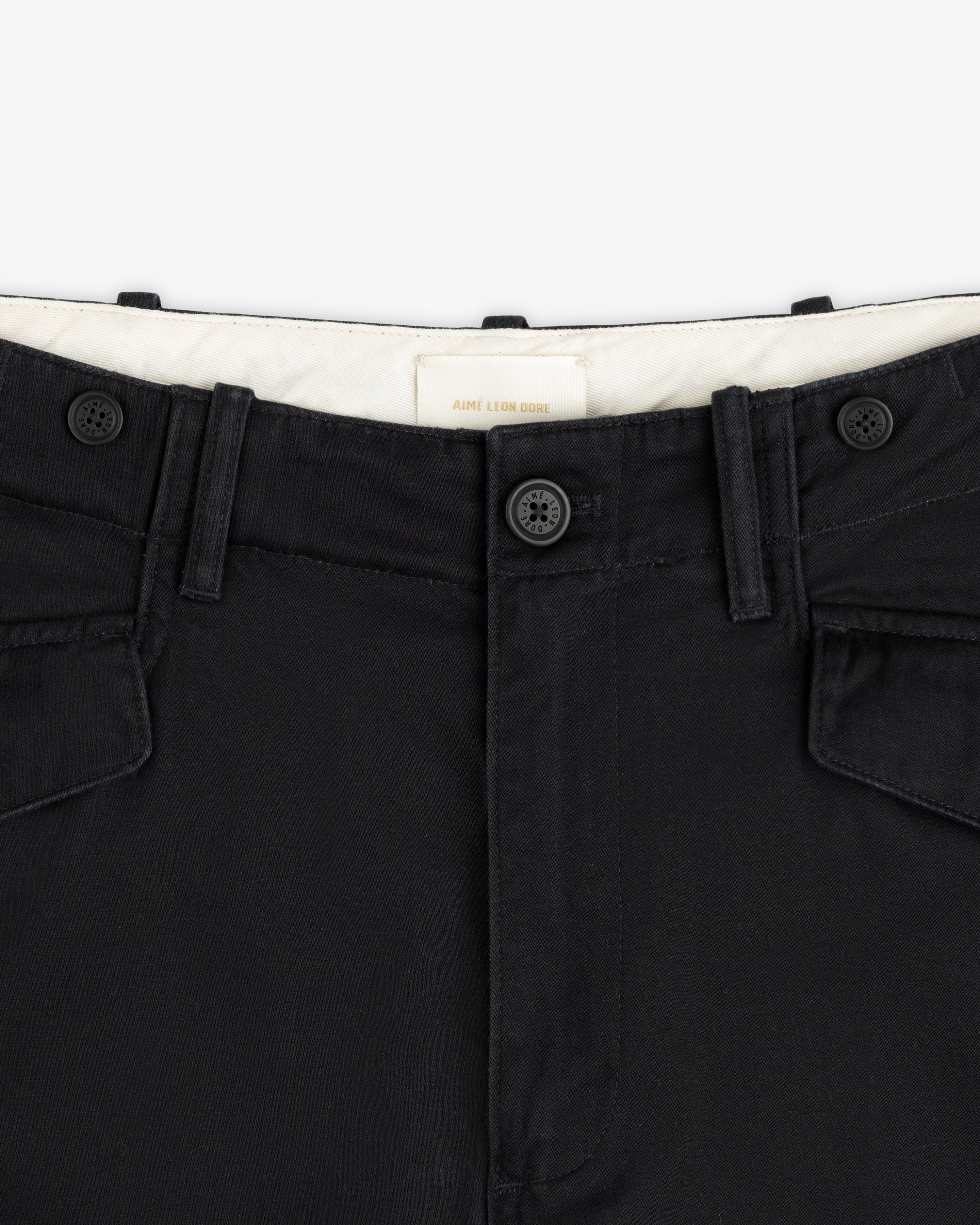 Close-up of the waistband, front buttons, and belt loops on the Fatigue Pant with visible stitching.