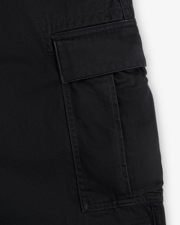 Close-up of a black cargo pocket with a flap and visible stitching on the Fatigue Pant.