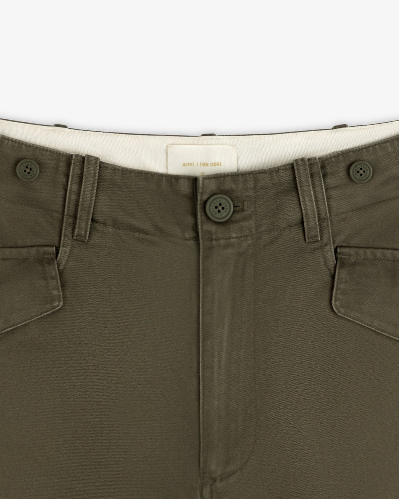 Close-up of Fatigue Pant in olive green with two buttons, belt loops, and white inner waistband.