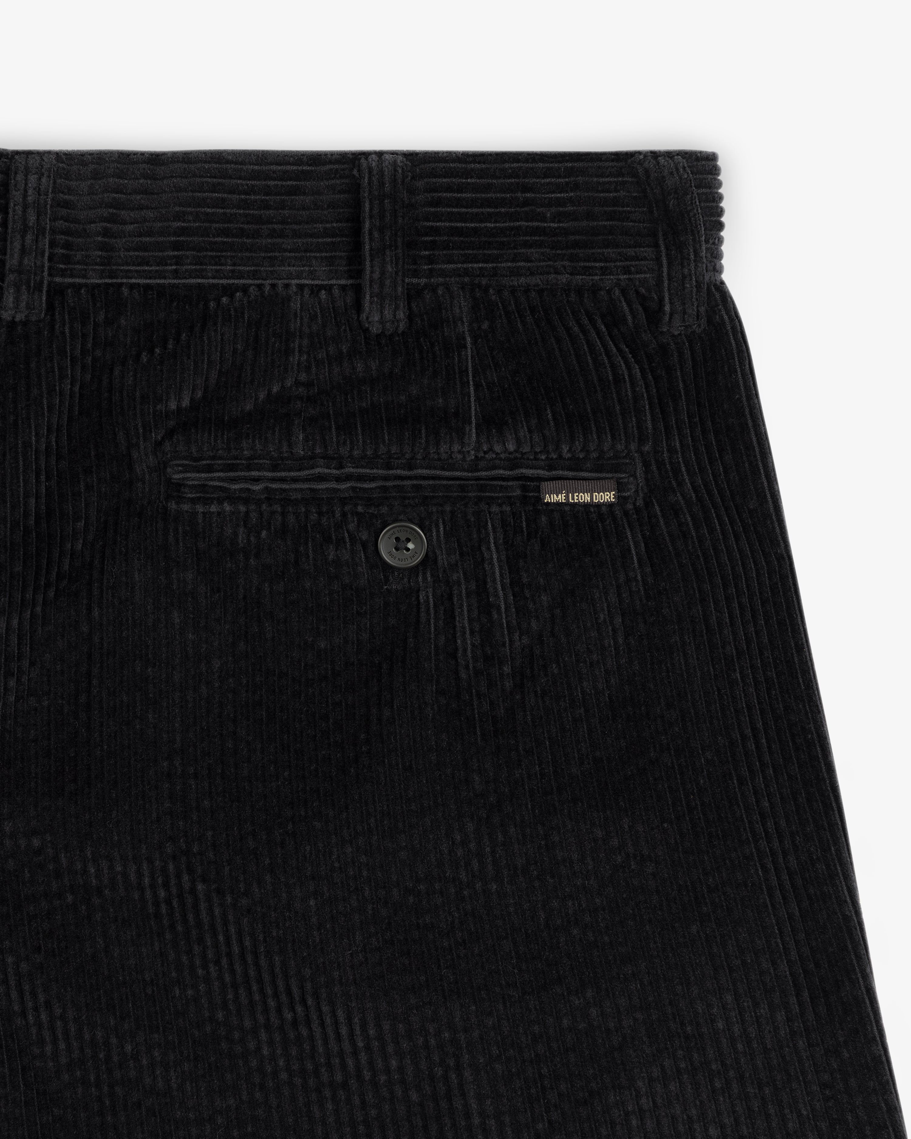 Black Corduroy Trouser with a buttoned back pocket and a small brand tab.