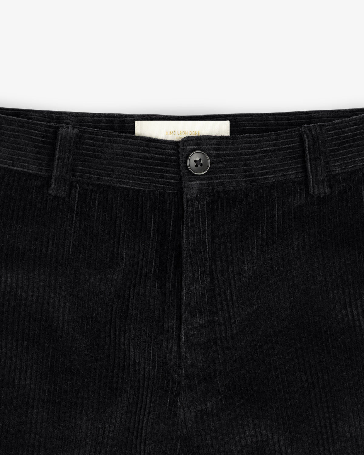 Black Corduroy Trouser with a button fly and a branded interior label.