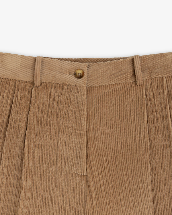 Tan Double Pleated Corduroy Trouser featuring a center button closure, belt loops, and front pleats.