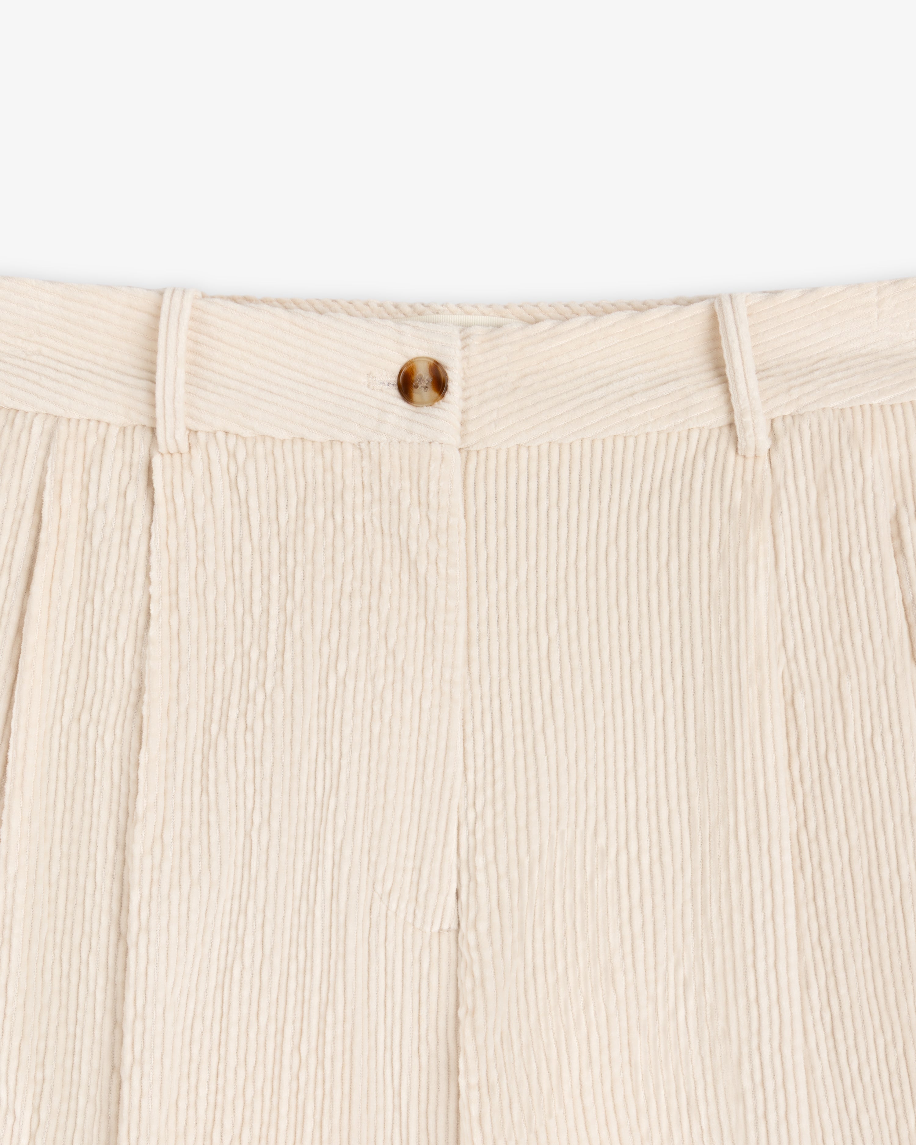 Cream-colored Double Pleated Corduroy Trouser with a pleated front and a single button closure.