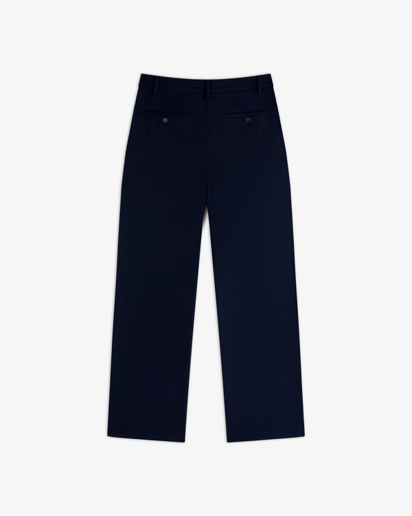 Back view of navy blue Mani Embroidered Wool Pant featuring two buttoned welt pockets.