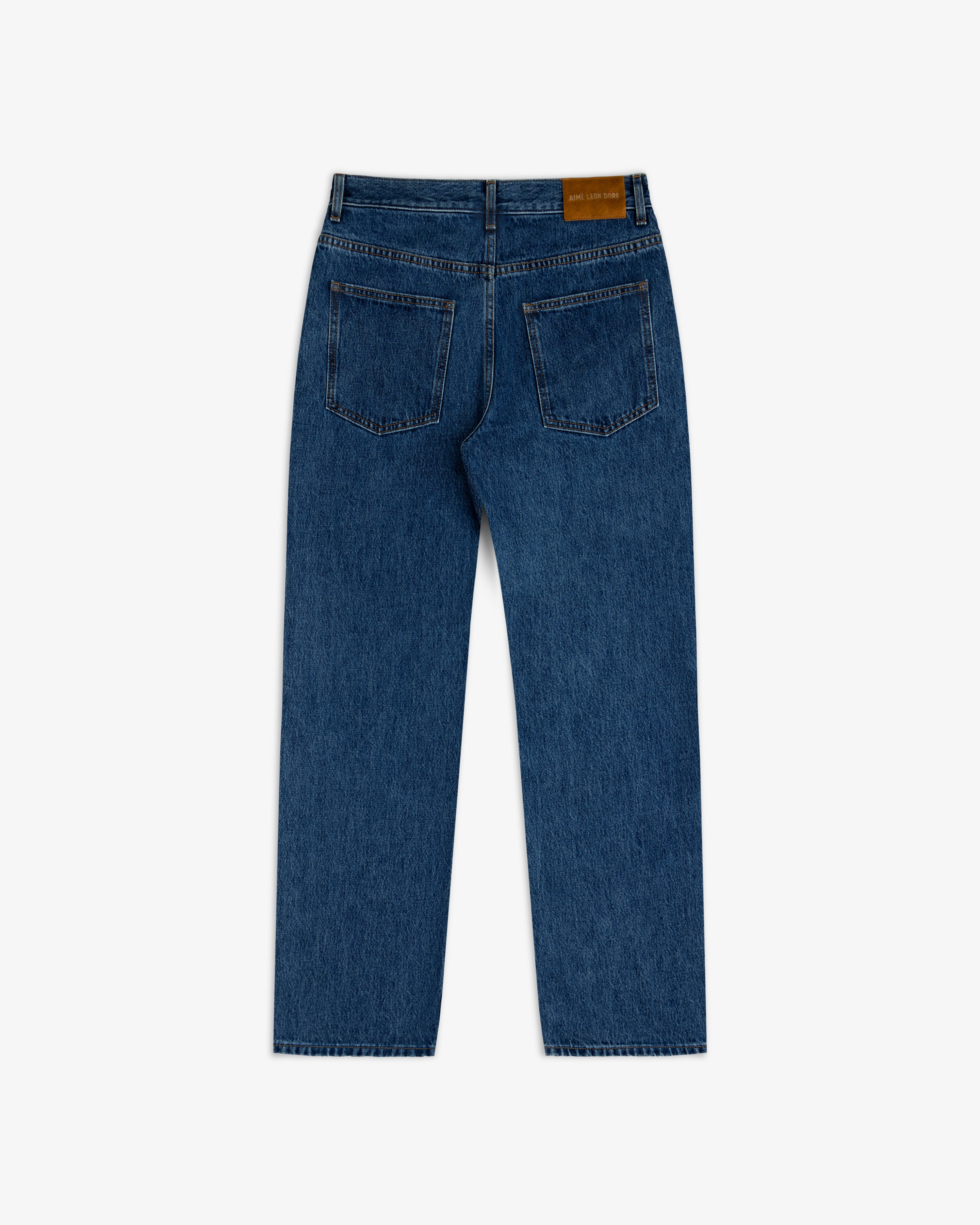 Back view of ALD Relaxed Fit Denim in dark wash with two back pockets and a leather waist patch.