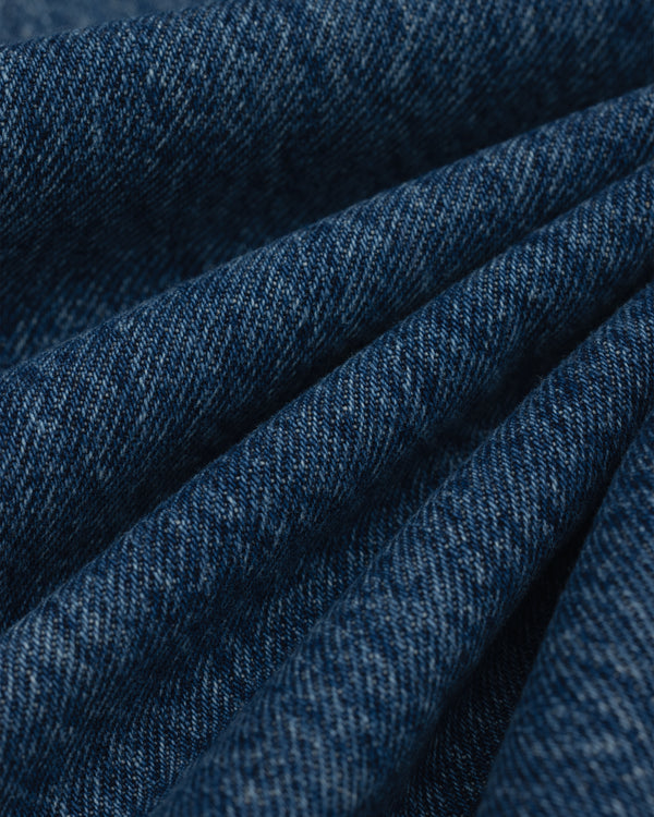 Close-up view of folded dark blue ALD Relaxed Fit Denim fabric.