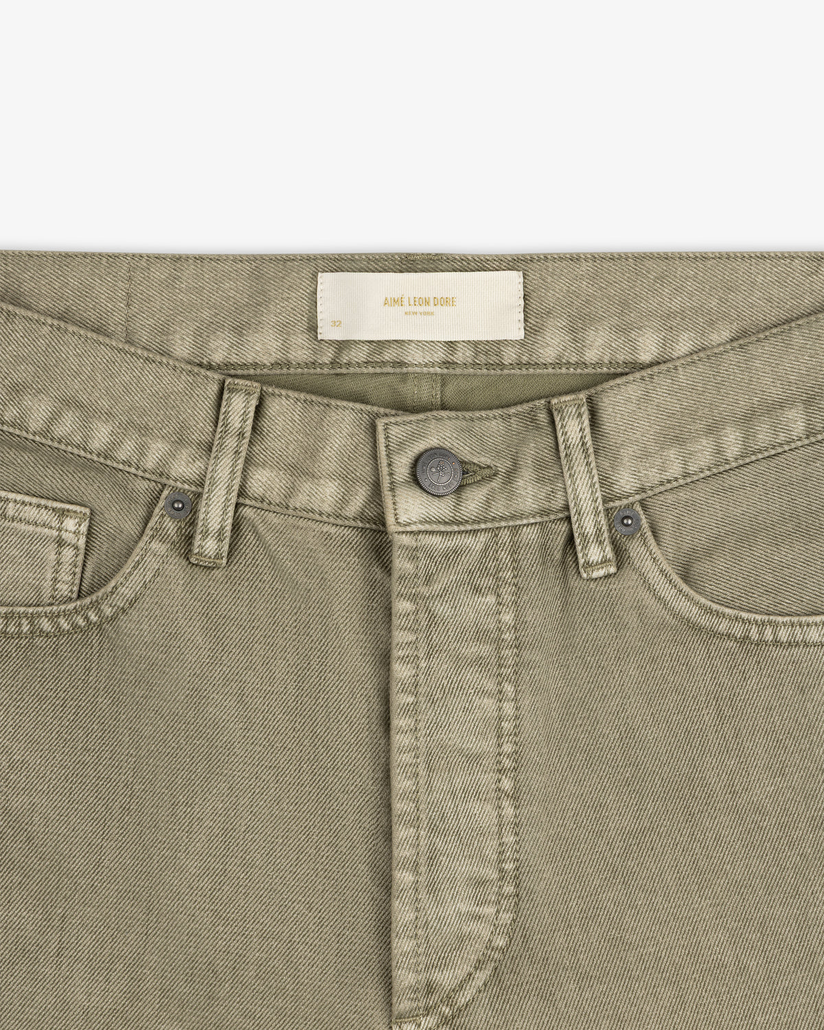 Flocked Straight Fit Denim pants in olive green with a button fly and a label at the waistband.