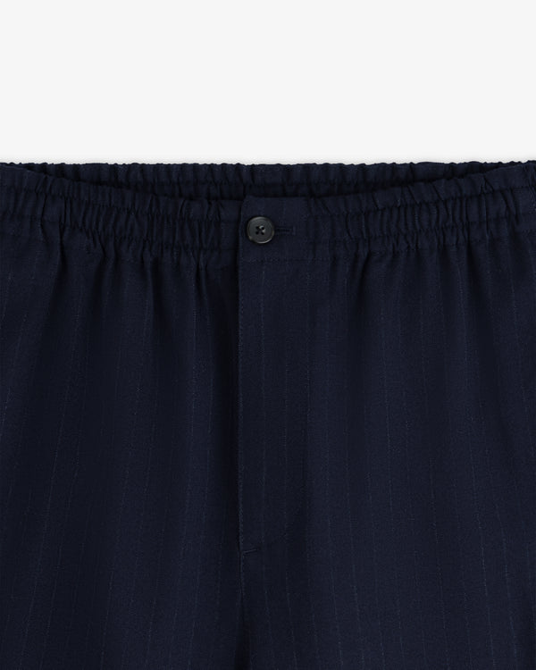 Wool Chalk Stripe Elasticated Waist Trouser in dark navy with an elasticated waistband and a single button closure.
