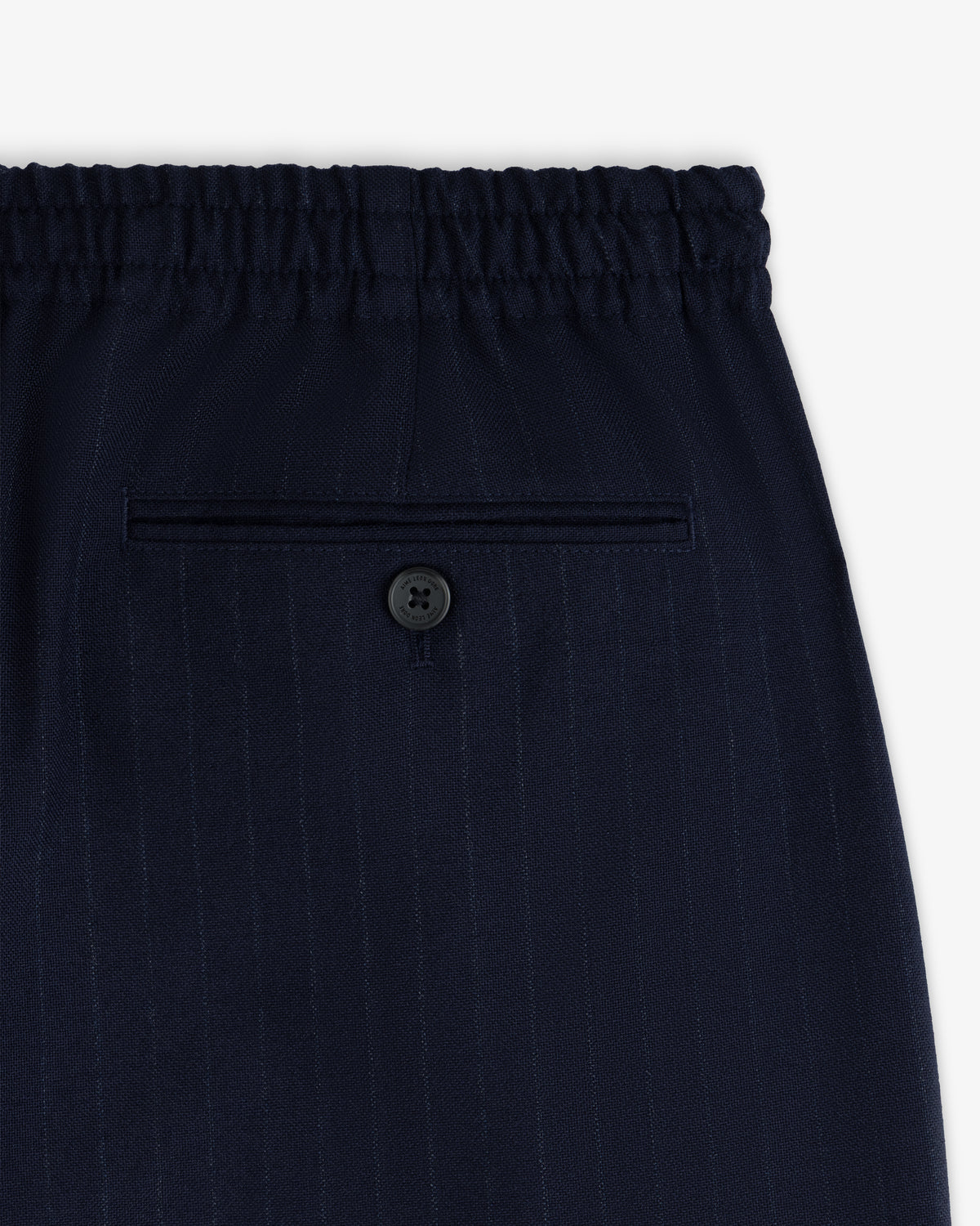 Wool Chalk Stripe Elasticated Waist Trousers in dark navy with an elasticated waistband and a single buttoned back pocket.