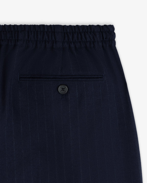 Wool Chalk Stripe Elasticated Waist Trousers in dark navy with an elasticated waistband and a single buttoned back pocket.