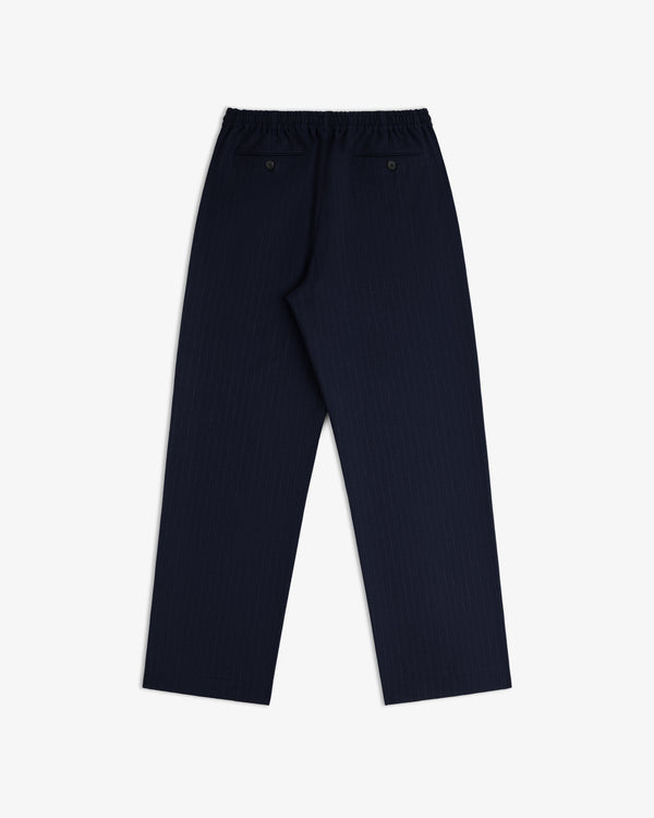 Wool Chalk Stripe Elasticated Waist Trouser in dark navy pinstripe with an elasticated waistband and two back pockets.